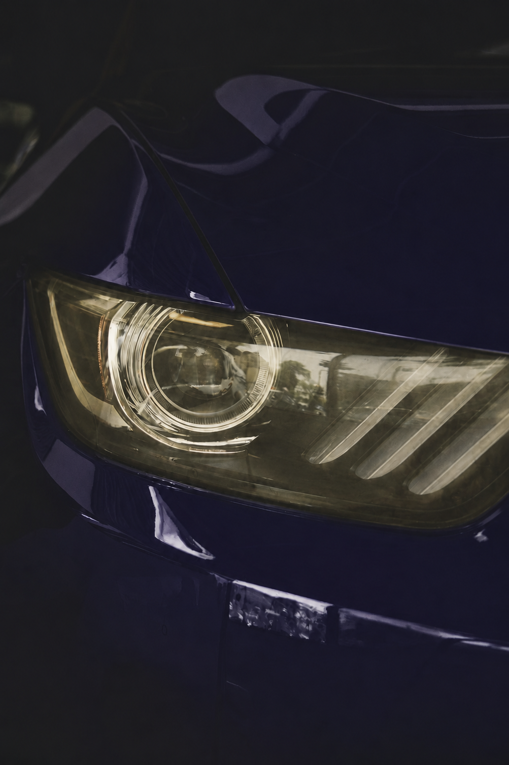 Before restoration, yellowed and foggy headlight lens
